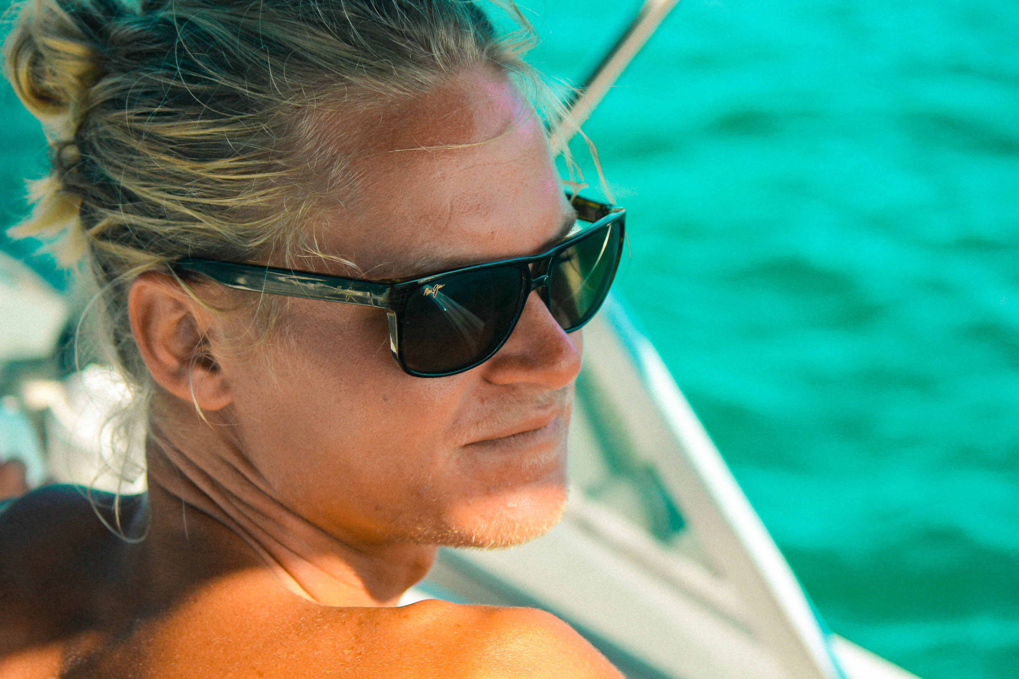 A woman in sunglasses on a boat
